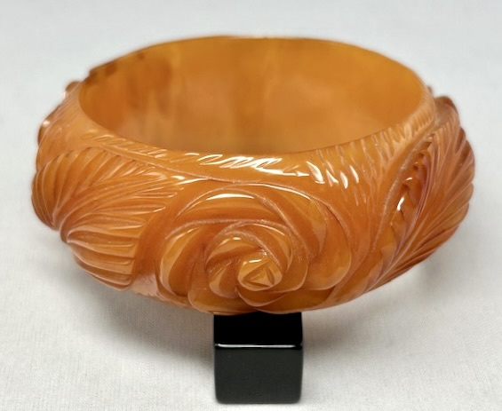 BB459 marbled amber heavily carved rose/leaf bakelite bangle